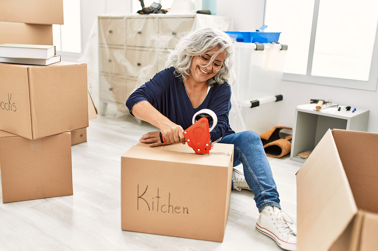 a woman packing boxes for her self-move