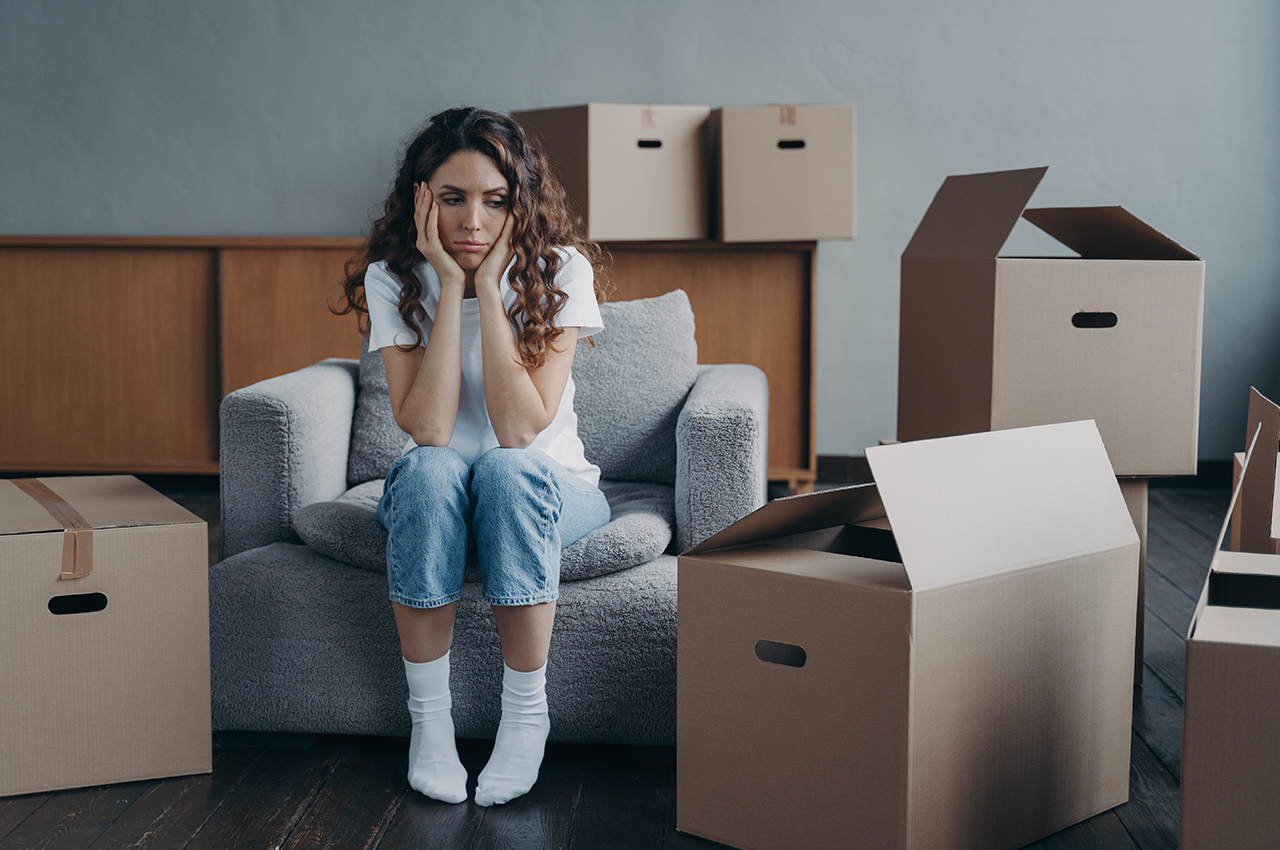 a woman stressing about moving away from family and friends